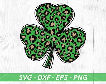 May include: A green shamrock with a leopard print pattern. The shamrock is outlined in black.