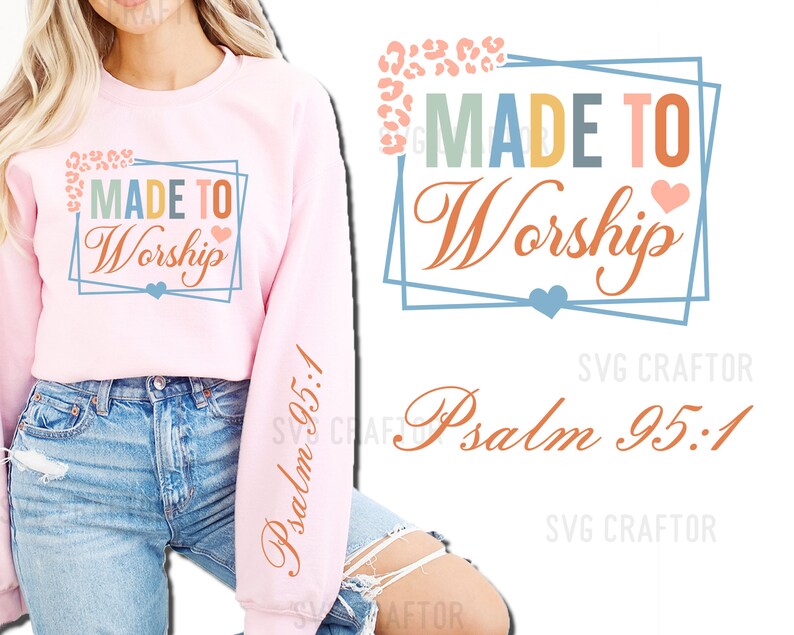 May include: Pink sweatshirt with the text "MADE TO Worship" and "Psalm 95:1" printed on it. The text is surrounded by a blue and orange frame with a heart design.