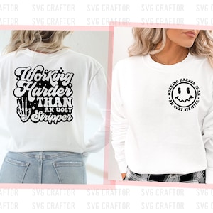 May include: White long-sleeve shirt with black text that reads "Working Harder Than An Ugly Stripper" on the back and a black smiley face with the same text on the front.