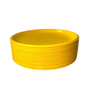 May include: A stack of bright yellow plastic dinner plates.