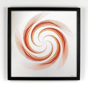 May include: Framed artwork featuring a spiral design in shades of orange and red. The artwork is created with thread on a white background, encased in a black frame. The spiral artwork is a modern abstract piece.