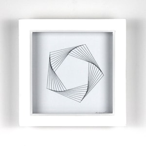 May include: A square white framed artwork with a geometric design. The artwork displays a black and white abstract pattern of lines forming a square shape. The design is centred on a white background.