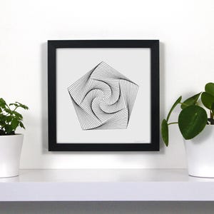 May include: Black framed art print featuring a black and white geometric design. The artwork is a pentagon shape with a spiral center. Two potted plants sit on a white shelf below the artwork.
