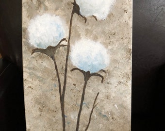 May include: A painting of three white cotton bolls on brown stems against a textured beige background. The artist's signature "EM 17" is in the bottom right corner.