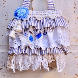 Blue Ruffled Shabby Chic/Boho Handbag/Purse. Made with Blue Ticking Fabric,And Eyelet Lace, With Layered Doilies. White A blue Velvet Flower