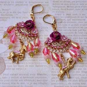 Shabby Chic Carousel Mismatched Drop/Dangle Earrings. Made With A Horse And Lion Gold Charms. And Pink Flowers, On A fan Shaped Gold Finding