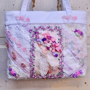 White Shabby Chic/Boho Purse/Handbag. Made With Beige And White Lace Cut On The Diagonal. With A Lady Graphic With Ribbon Flowers On Her Hat