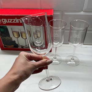 Guzzini tall glasses for champagne or wine, vintage 4 stemglass set in clear acrylic new in box Italy 1980s