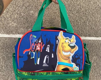 Bolsa de almuerzo de nailon de Scooby-Doo (modelo descatalogado de 2011) con correa ajustable.