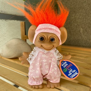 Vintage cute weird Uneeda Troll with orange hair, pink floral jumpsuit & paper tag, Wishnik Good Luck troll doll