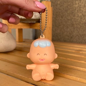Tinkle Tots mini vinyl baby doll keychain 1990 Tomy, vintage miniature baby toy with blue hair key ring