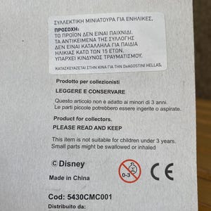 May include: A white box with a warning label in Greek and English. The label states that the product is not a toy and is not suitable for children under 3 years old. The box also includes the Disney logo, a CE mark, and the text "Made in China".