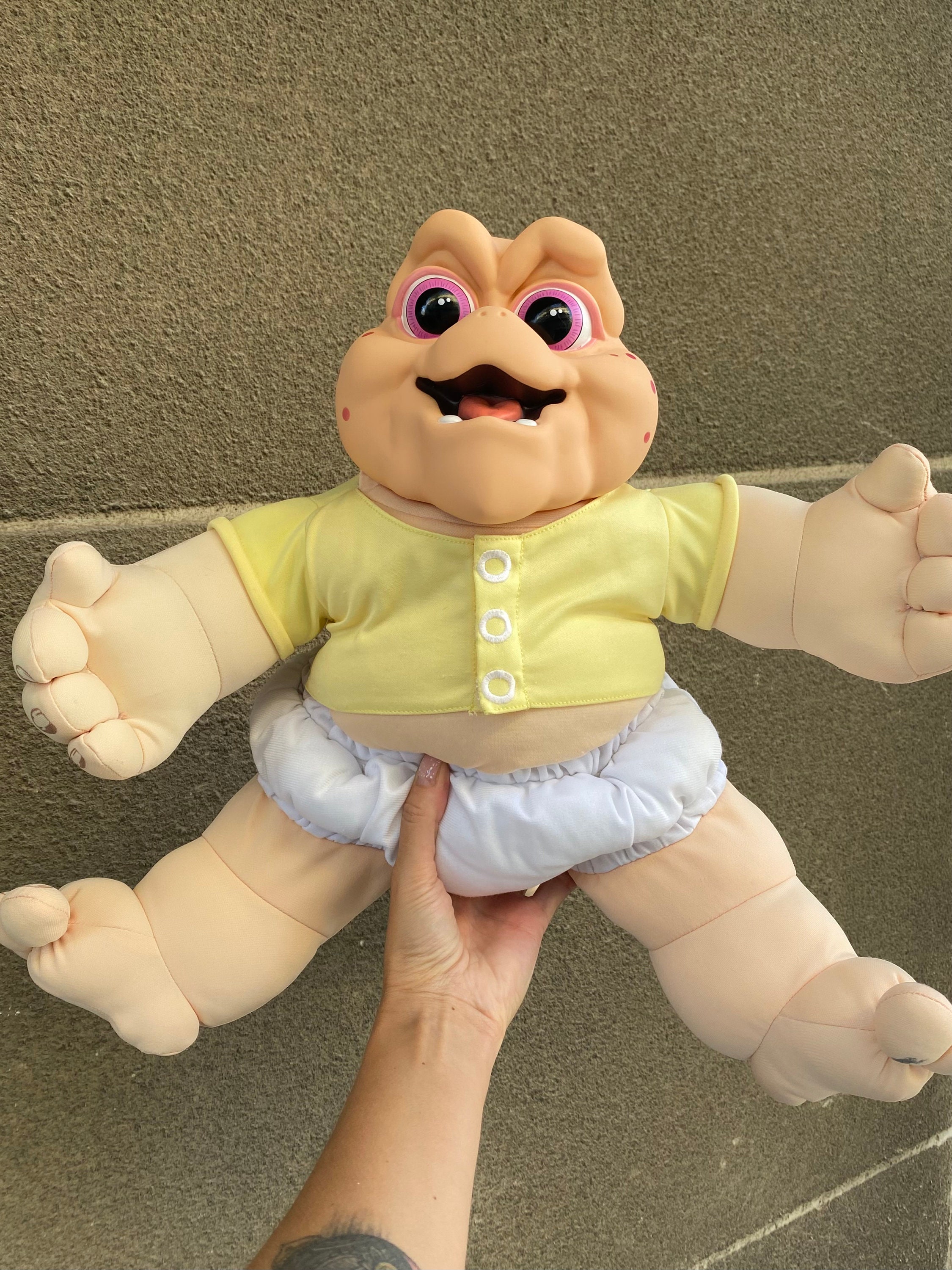 Baby sinclair sales stuffed animal