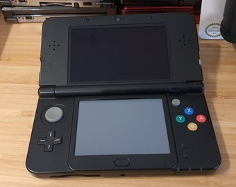 New Nintendo 3ds black edition. With free games.Original.Super condition. Vintage game with charger. .Region free . 5000 games