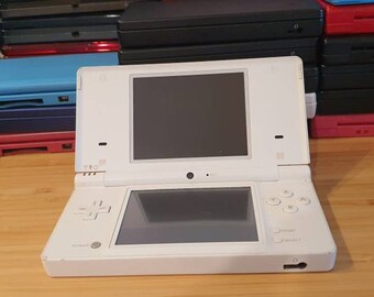 Nintendo dsi ice White edition. With 100+ games. Original. good condition. Vintage game console with charger. Free case .