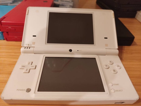 Nintendo DSi XL with original games, charger and case 