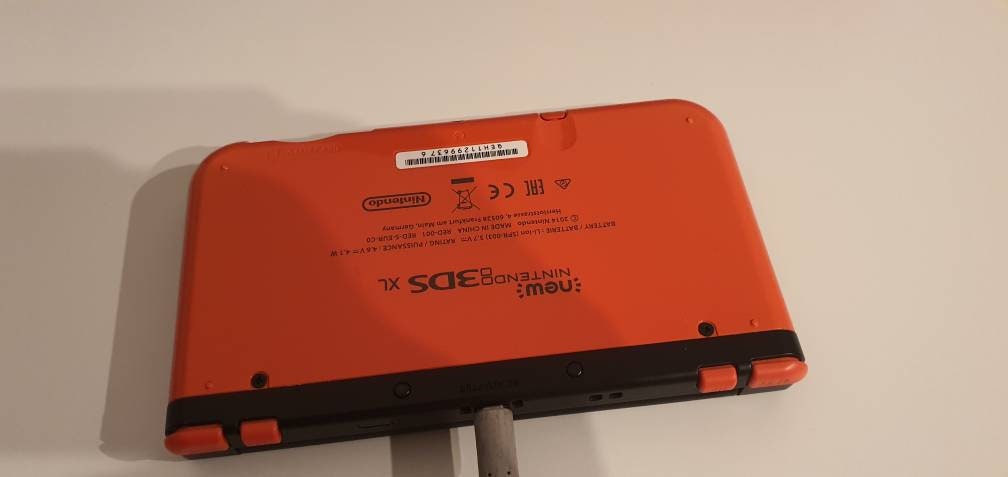 Nieuwe Nintendo 3ds XL orange.5k spellen. 128 GB. In goede staat