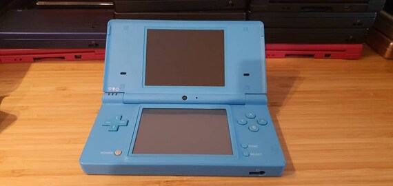 Nintendo DSi Light Blue Handheld Console Game System with charger and case