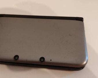 Nintendo 3ds XL gray edition.5000 games. 128gb. Used condition.with charger.  Fully loaded Region free device.  Retro games