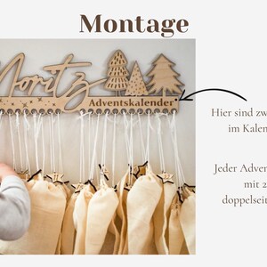 May include: A light-colored wooden wall-mounted advent calendar featuring the name Moritz, three stylized trees, and the text Adventskalender. It includes twenty-four small holes for hanging individual fabric pouches with white strings and star-shaped tags.