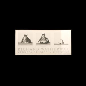 May include: A black and white photograph featuring three panels. Each panel depicts a cat in different poses. The text "RICHARD WATHERWAX KENNEDY STUDIOS • KEY WEST" is printed in a serif font below the images.