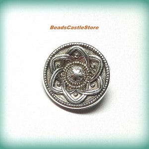May include: Silver and gold Celtic knot button with a clover design in the center. BeadsCastleStore is printed at the top of the image.