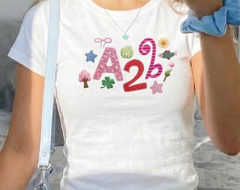 Maglietta per neonati AND2BLE con grafica patchwork e scritta