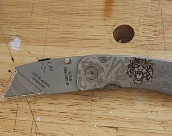 Laser engraved utility knife