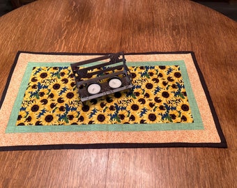 Quilted Sunflower Table Runner Bordered in a Green Variegated and Tan with White Flowers Strips with Black Binding