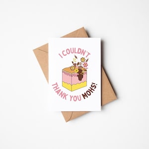May include: A white greeting card with the text "I COULDN'T THANK YOU MOHS!" in pink. The card features a graphic of a layered cake with flowers. The card is on top of a brown envelope.