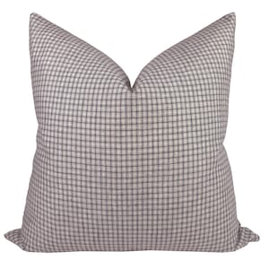 May include: A square throw pillow with a white and dark grey checkered pattern.