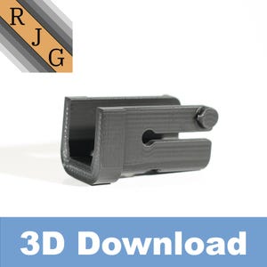 May include: A 3D printed black plastic part with a U-shaped opening and a small metal pin. The part is designed to be used as a connector or a bracket.