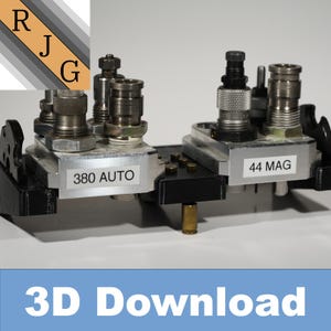 May include: A close-up of a reloading press with two different caliber dies. The dies are labeled "380 AUTO" and "44 MAG".