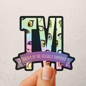 May include: A sticker featuring the letters "TVM" filled with cartoon eyes in various colors. A banner below reads "Teacher of the Visually Impaired". The sticker has a gradient background of purple, green, and yellow.