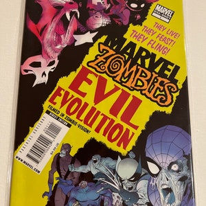 May include: A comic book cover featuring a yellow background with the title "Marvel Zombies Evil Evolution" in red and black lettering. The cover features a group of zombie superheroes, including Spider-Man, Wolverine, and Captain America, in a chaotic scene.