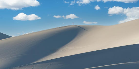 Hikers, Tiny Atop the Great Sand Dunes