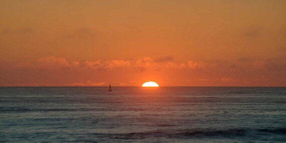 Sunrise Peeks Over the Ocean