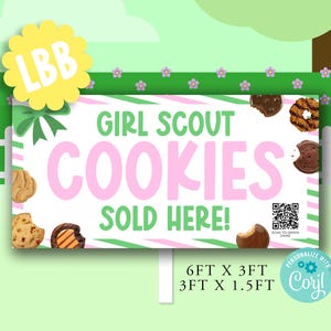 May include: A sign advertising Girl Scout Cookies, with the text "GIRL SCOUT COOKIES SOLD HERE!" in green and pink. The sign is 6 feet by 3 feet, or 3 feet by 1.5 feet. Various cookies are pictured around the sign.