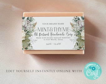 May include: A white bar of soap with a floral design label. The label reads "MINT&THYME All Natural Handmade Soap Made with locally sourced materials in Fort Worth, Texas 340G - 13.4OZ".