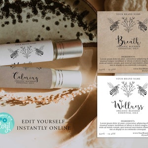 May include: Three brown paper labels with black text and illustrations of bees and flowers. The labels read "Calming", "Breath", and "Wellness". Each label includes the text "Organic Blended Essential Oils" and the brand name "Your Brand Name".