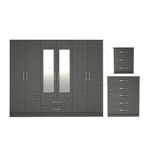May include: A grey bedroom set featuring a six-door wardrobe with mirrored doors and two matching chest of drawers.
