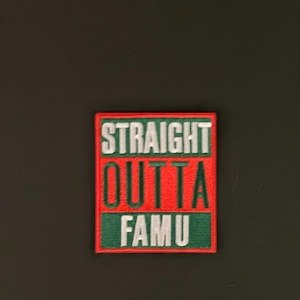 May include: A red and green embroidered patch with the text "STRAIGHT OUTTA FAMU" in white.