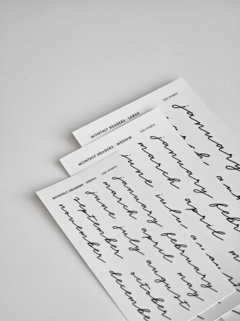 May include: Three white rectangular sheets of paper featuring black printed text. Each sheet displays the text 1521 STUDIO and MONTHLY HEADERS followed by the size, either LARGE, MEDIUM, or SMALL. The sheets contain lists of months in cursive.