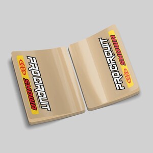 May include: Two beige stickers with the text "PRO CIRCUIT" in red and "SHOWA" in yellow with a globe icon.