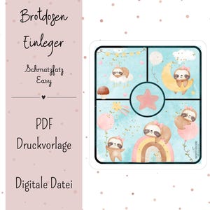 May include: A square, divided lunchbox insert with a watercolor design. The insert features cartoon sloths on a cloud, moon, and rainbow, with a star in the center. The background is a light blue with watercolor effects.