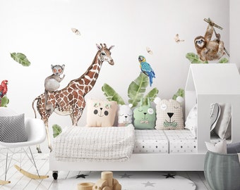May include: A white bed with a white headboard and a white blanket. There are four stuffed animals on the bed, and a giraffe, a lemur, a parrot, and a sloth are on the wall behind the bed.