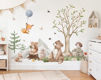 May include: A set of woodland animal wall decals featuring a fox with a blue balloon, a bear, a squirrel, a rabbit, a hedgehog, and a tree. The decals are perfect for a nursery or child's room.