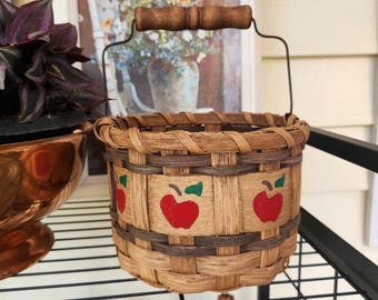 Vtg 80s wicker basket with wood handle, and hand painted apples on one side and snowflakes on the other, cottagecore farmhouse decor