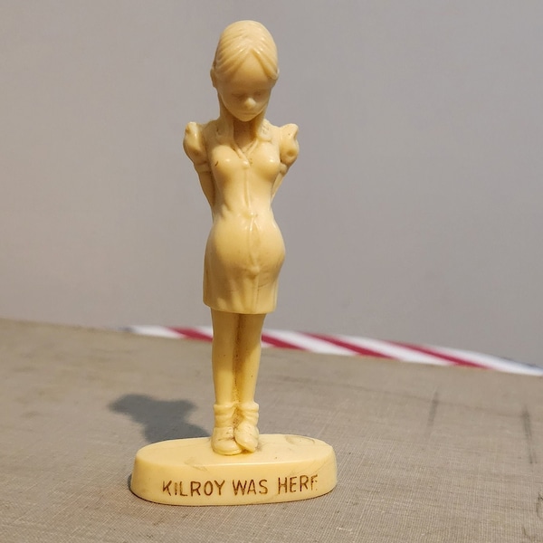 WWII war memorabilia,"Kilroy Was Here" small pregnant girl bakelite figurine, kitschy throwback conversation piece
