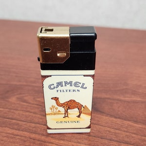 Vintage Camel Filters lighter, Genuine camel and Imposter cow with hay hump, cigarette advertisements, retro throwback Camel cigarettes